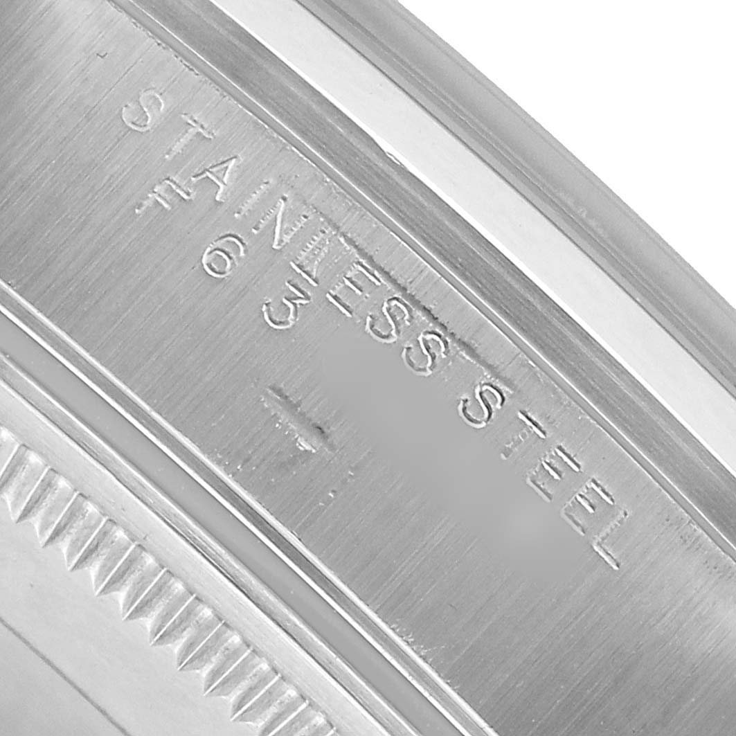 The image shows a close-up of the stainless steel case back of a Rolex Air-King 14000 Men's Stainless Steel Pink Dial, highlighting the engraved text.