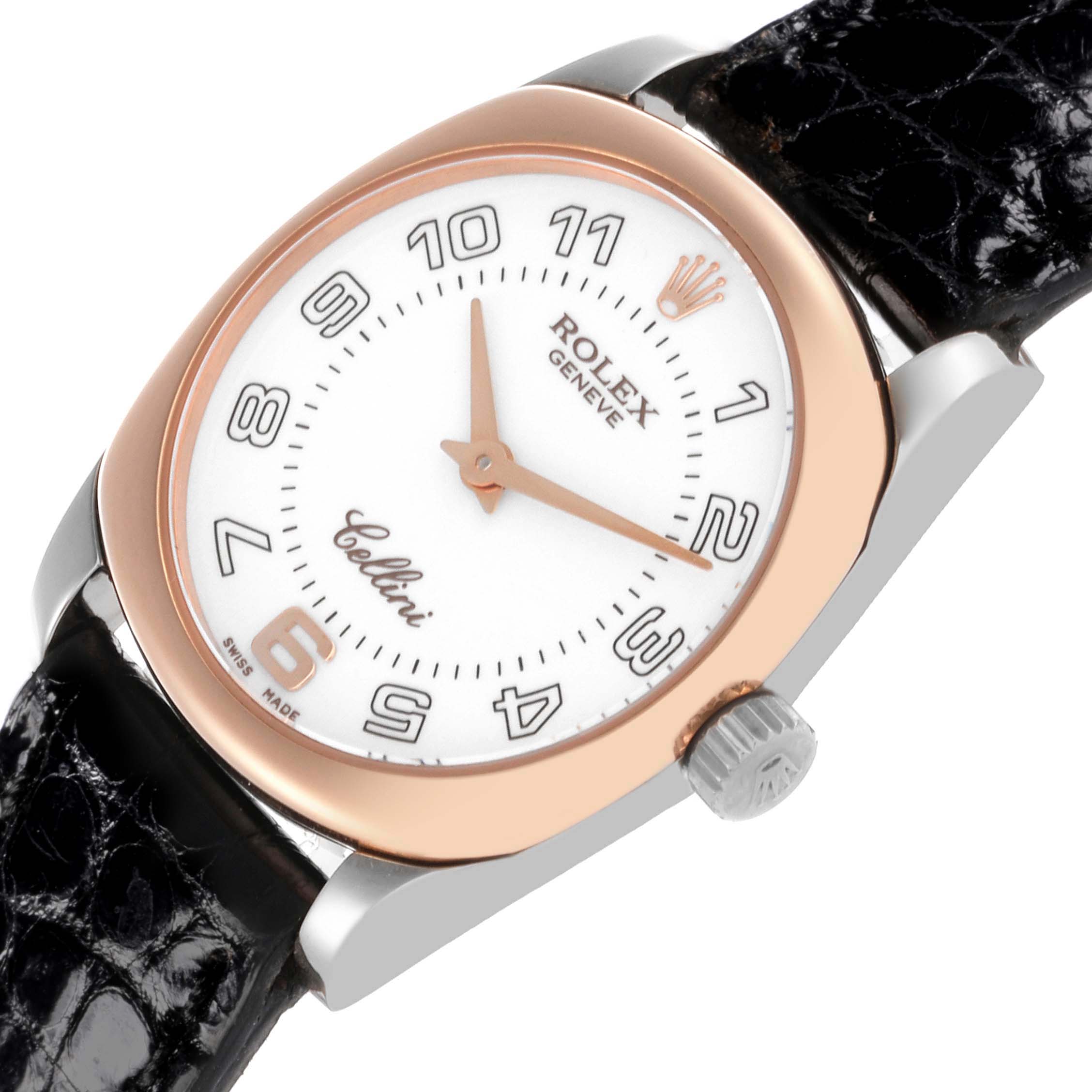 The Rolex Cellini 6229 Women's White Gold White Dial 6229 Women's White Gold White Dial watch is shown at an angled close-up, displaying the dial, rose gold bezel, and part of the black leather strap.