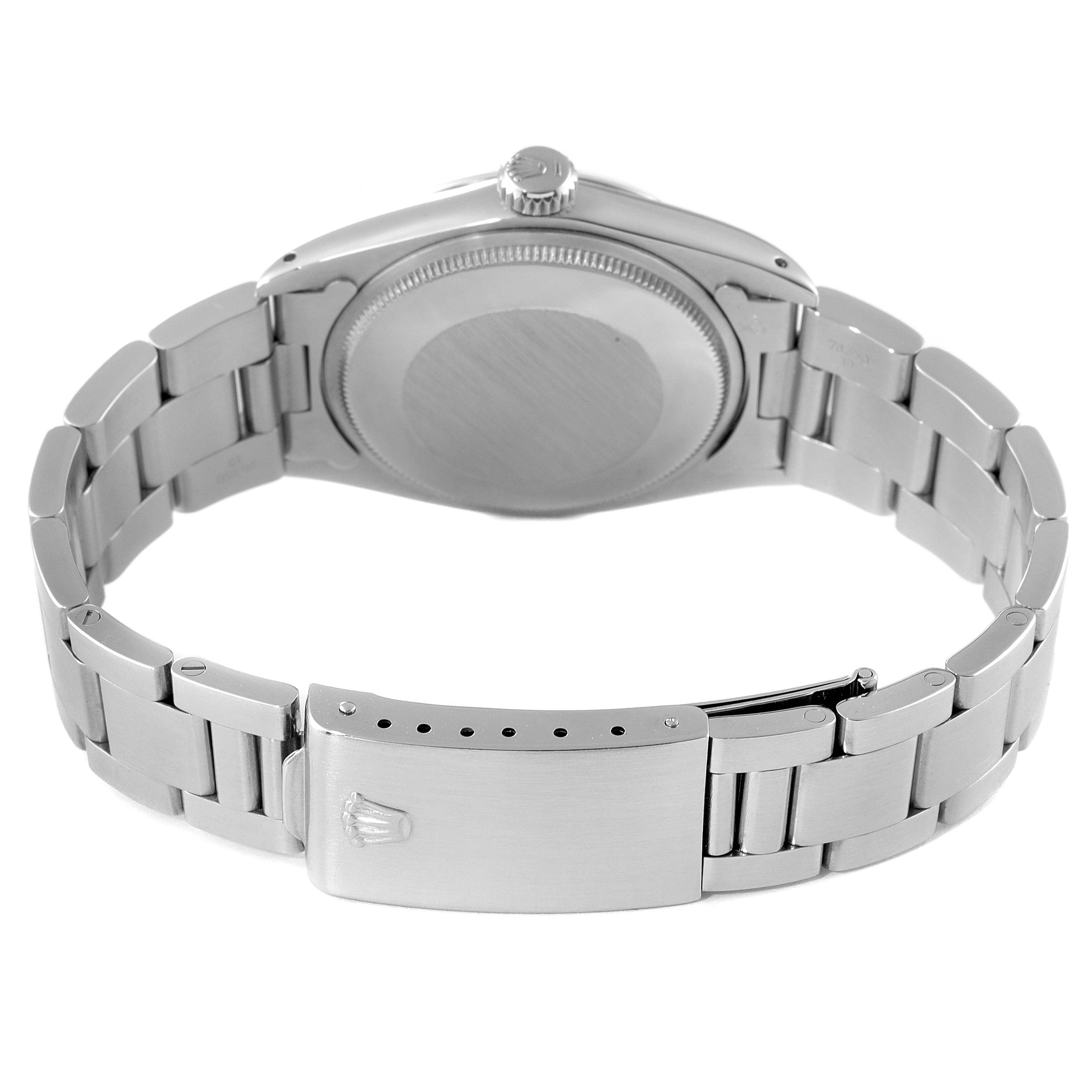 This image shows the underside of a Rolex Vintage Collection 1500 Men's Stainless Steel Silver Dial 1500 Men's Stainless Steel Silver Dial watch, highlighting the bracelet and clasp.