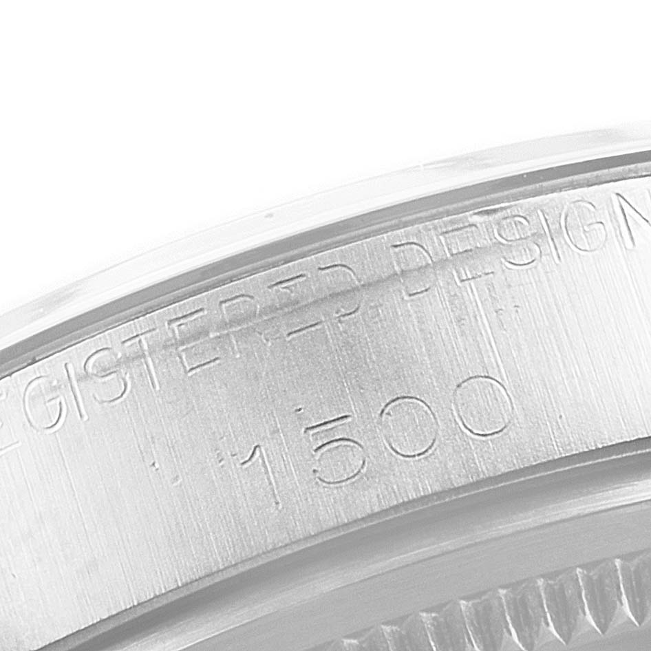This close-up image shows the engraved serial number on the side of the case of a Rolex Vintage Collection 1500 Men's Stainless Steel Silver Dial 1500 Men's Stainless Steel Silver Dial watch.