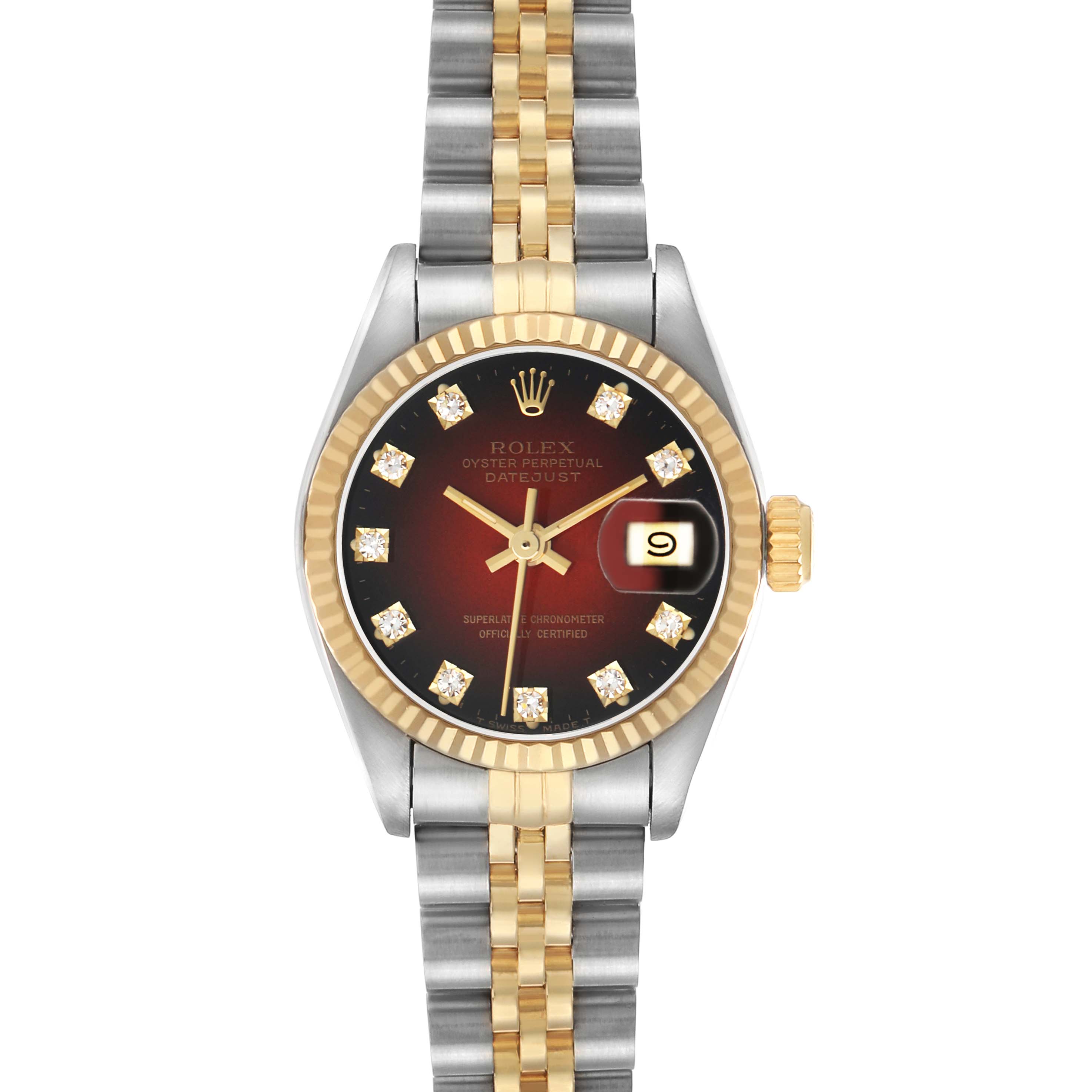 The Rolex Datejust 69173 Women's Steel and Gold (two tone) Red Dial is shown from a top view, highlighting its gold and silver bracelet, diamond indices, and date feature.