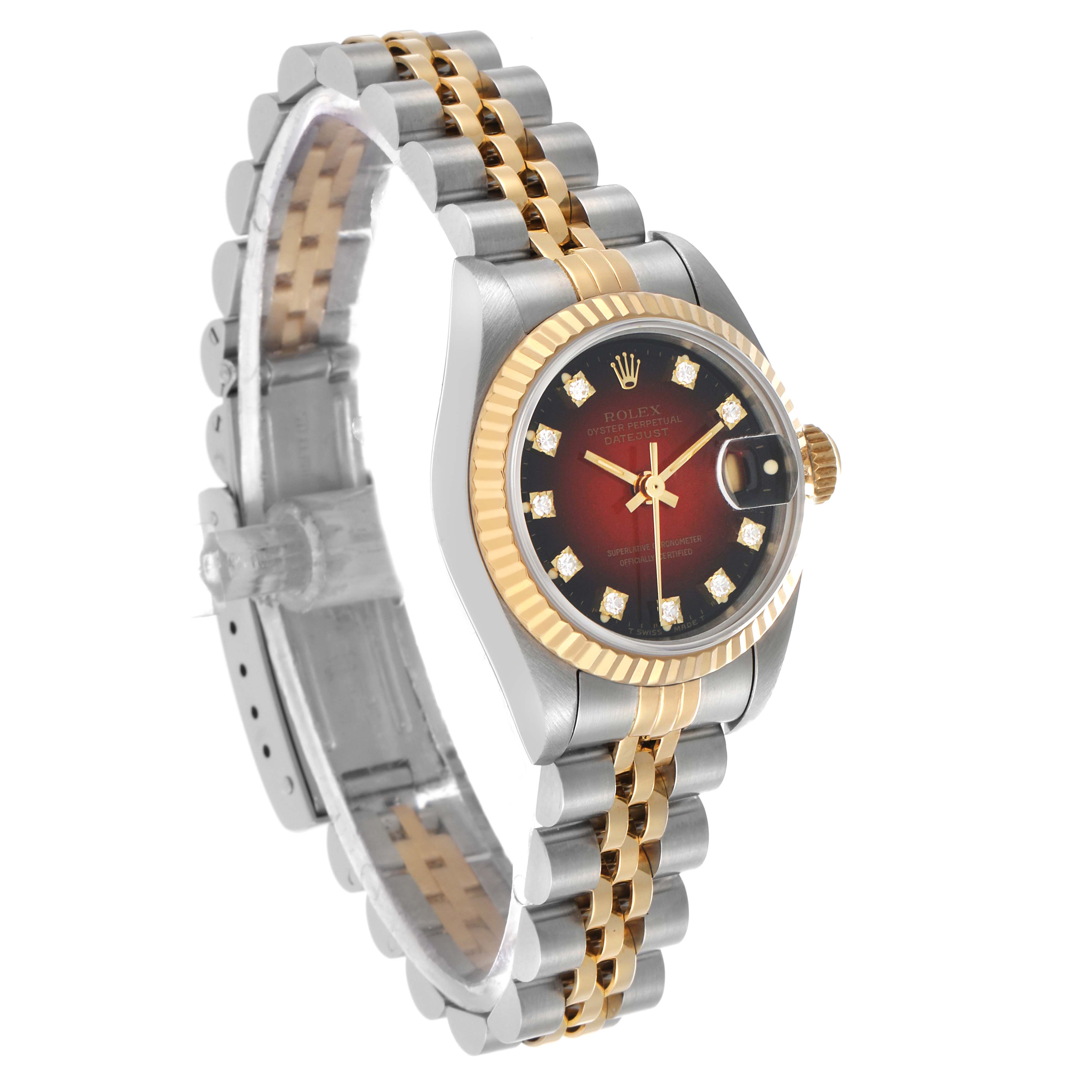 The Rolex Datejust 69173 Women's Steel and Gold (two tone) Red Dial watch is shown at a three-quarter angle, displaying the face, bezel, and bracelet.