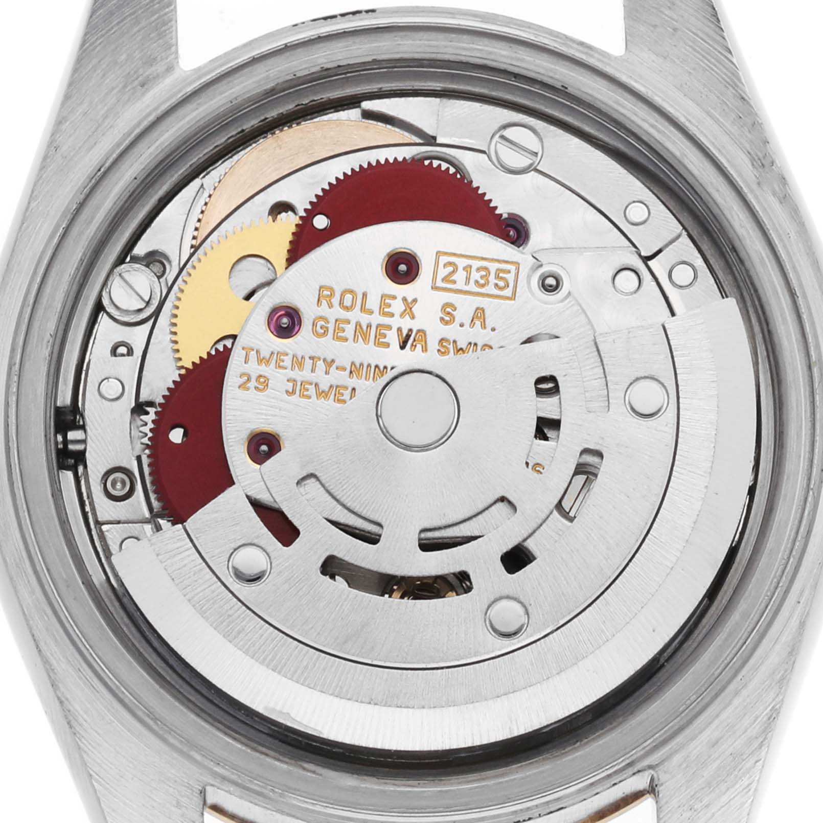 The image shows the movement of a Rolex Datejust 69173 Women's Steel and Gold (two tone) Red Dial watch, viewed from the back, highlighting its intricate mechanical components.