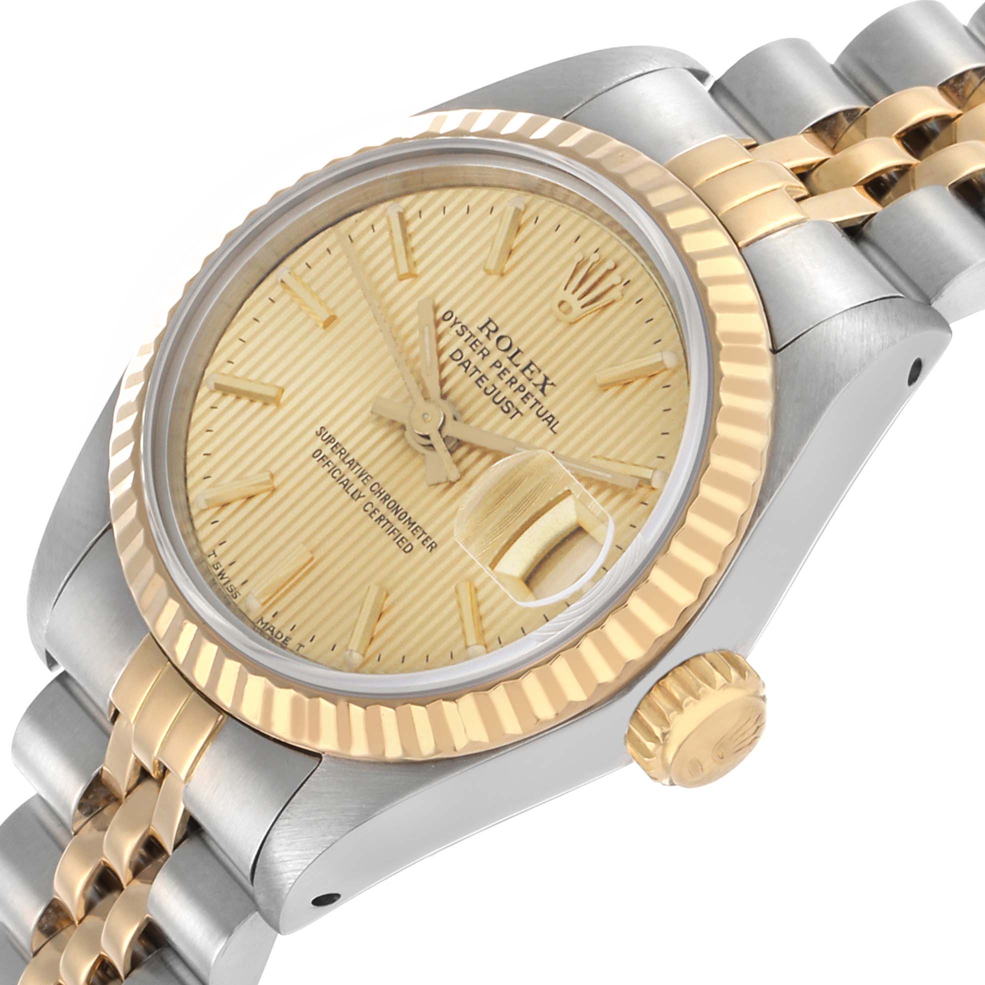 The Rolex Datejust 69173 Women's Steel and Gold (two tone) Champagne Dial is shown at a slight angle, highlighting its gold fluted bezel, crown, and two-tone bracelet.