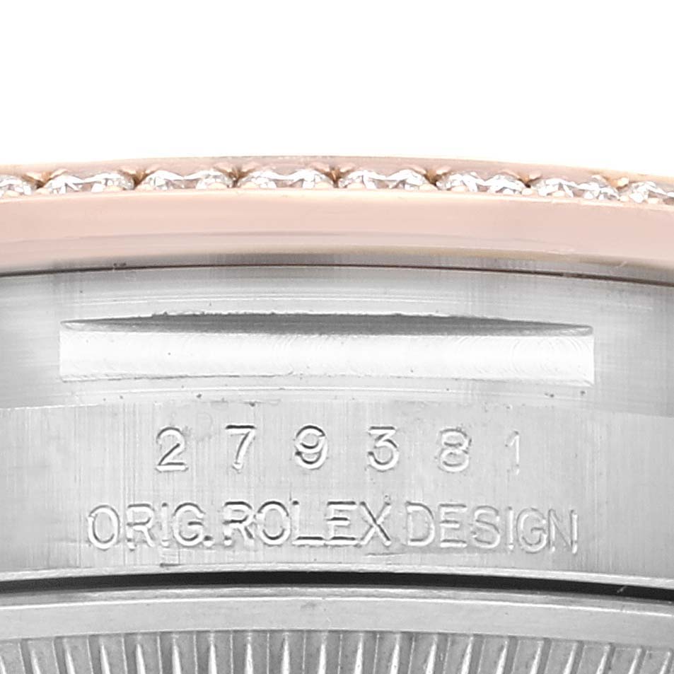 The image shows a close-up of the side of a Rolex Datejust 279381 Women's Steel and Gold (two tone) Brown Dial 279381 Women's Steel and Gold (two tone) Brown Dial watch, featuring its engraved serial number and "ORIG. ROLEX DESIGN" inscription.