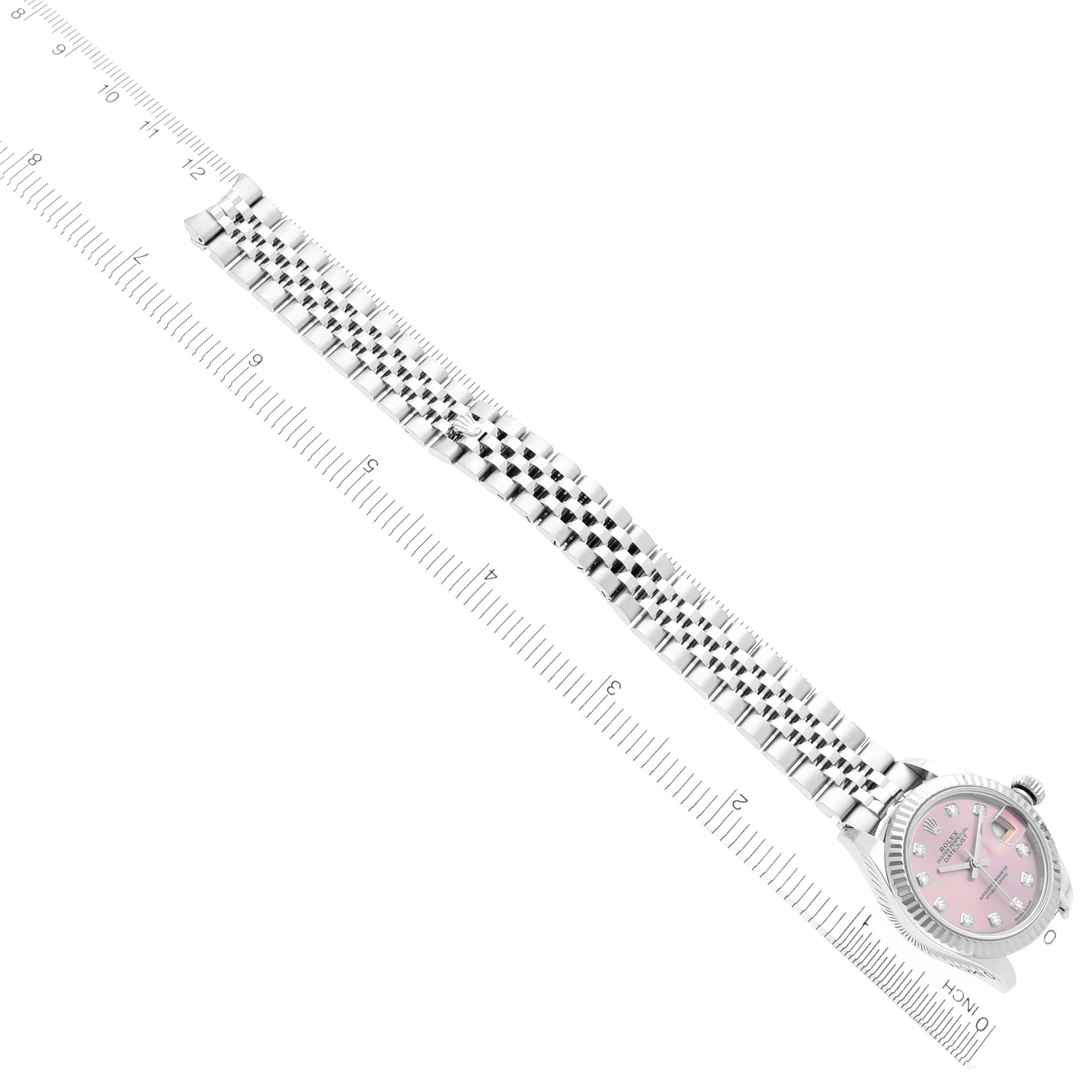 The Rolex Datejust 279174 Women's Stainless Steel Pink Dial 279174 Women's Stainless Steel Pink Dial watch is shown flat with full bracelet visible, alongside a ruler for scale.