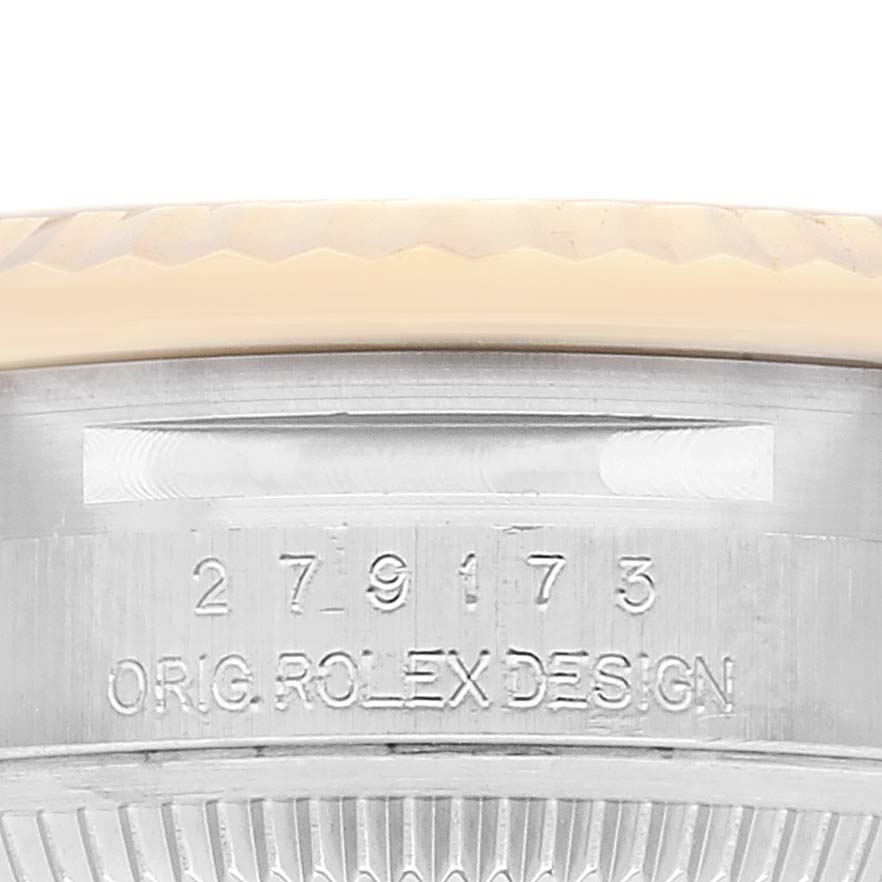 This image shows an angled close-up of the Rolex Datejust 279173 Women's Steel and Gold (two tone) White Dial 279173 Women's Steel and Gold (two tone) White Dial's case side, highlighting the serial number and "ORIG ROLEX DESIGN" engraving.