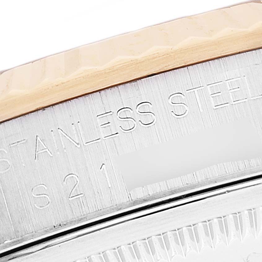 The image shows a close-up angle of the Rolex Datejust 16233 Men's Steel and Gold (two tone) Blue Dial 16233 Men's Steel and Gold (two tone) Blue Dial's bezel and edge of the case, highlighting the "STAINLESS STEEL" engraving.