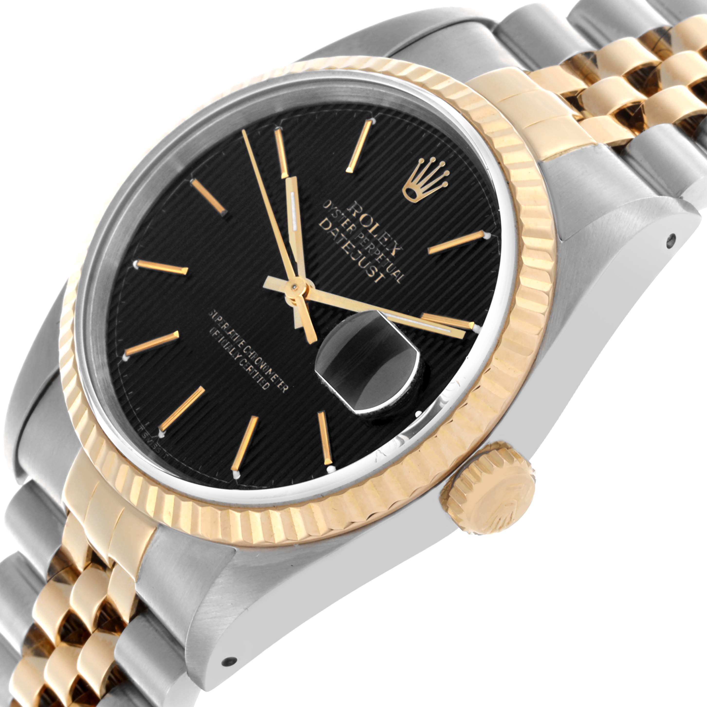 The Rolex Datejust 16233 Men's Steel and Gold (two tone) Black Dial 16233 Men's Steel and Gold (two tone) Black Dial watch is shown at a slight angle, highlighting the bezel, dial, crown, and two-tone bracelet.