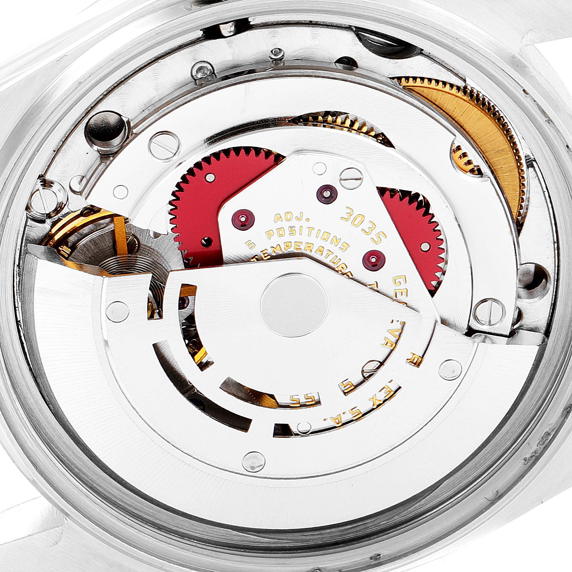 The image shows the internal mechanism of a Vintage Collection Rolex watch, highlighting its gears and detailed components.