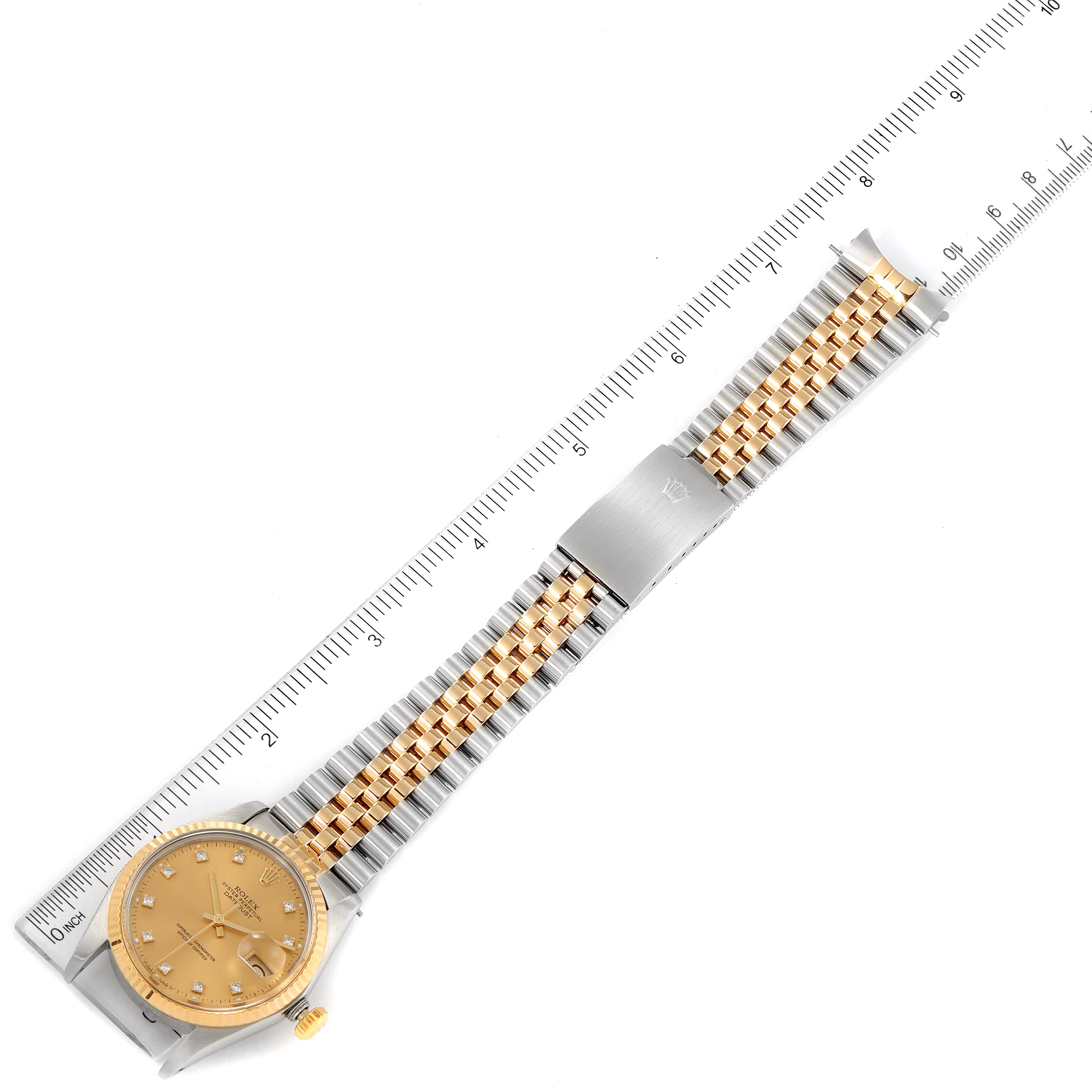 The Rolex Vintage Collection 16013 Men's Steel and Gold (two tone) Champagne Dial 16013 Men's Steel and Gold (two tone) Champagne Dial watch is shown flat at a top-down angle, highlighting the dial and bracelet with a ruler for scale.