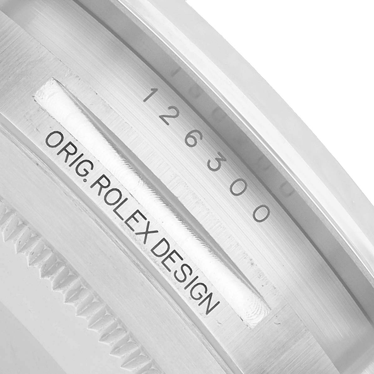 The image shows a close-up of the model number and "Orig. Rolex Design" engraving on the inner bezel of a Rolex Datejust 41 126300 Men's Stainless Steel Blue Dial.