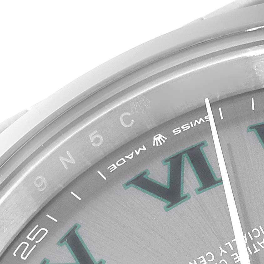 This image shows a close-up of the Rolex Datejust 41 126300 Men's Stainless Steel Grey Dial 126300 Men's Stainless Steel Grey Dial model, highlighting the bezel and part of the dial with "SWISS MADE" inscription.