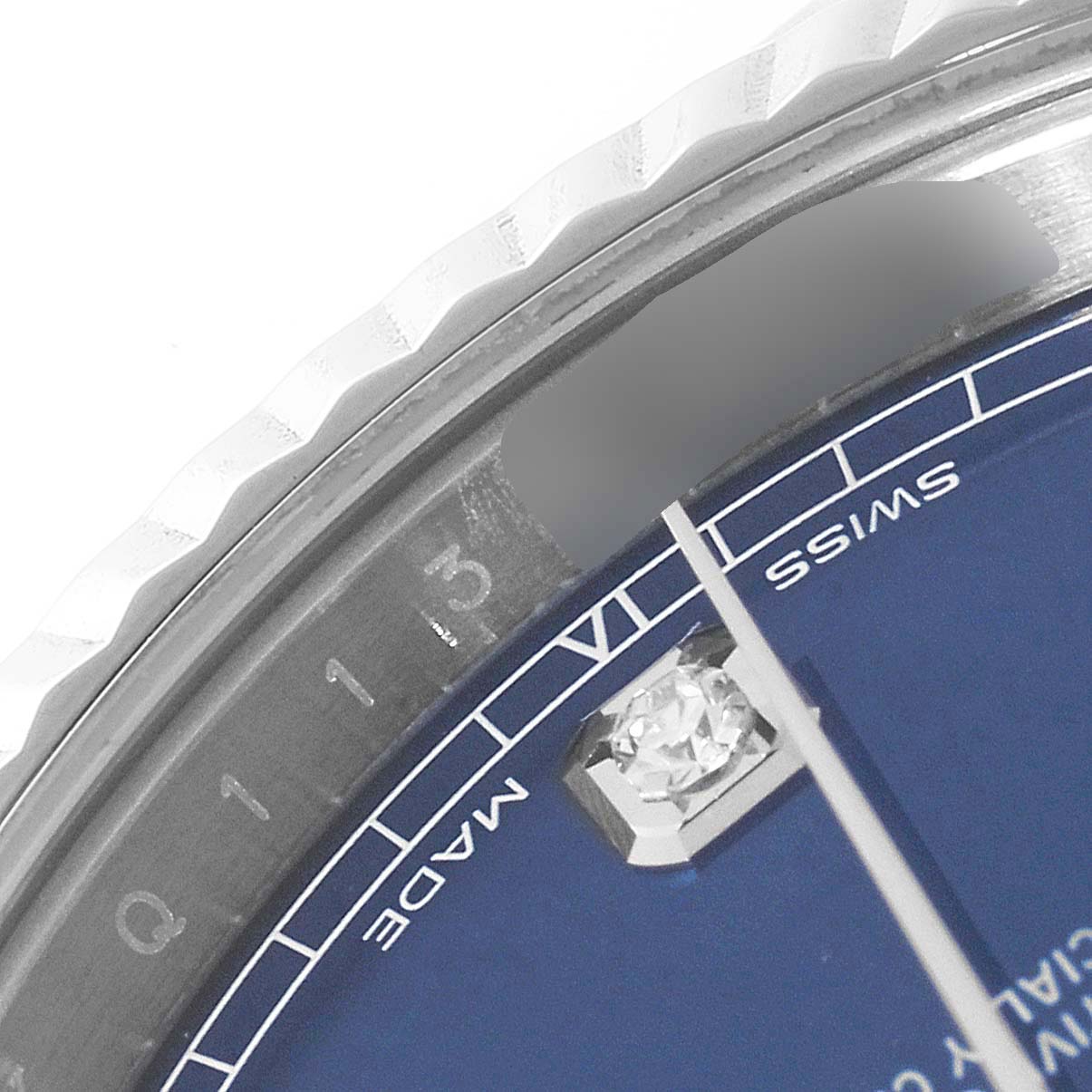 The image shows a close-up of the dial and bezel of the Rolex Datejust 41 126334 Men's Stainless Steel Blue Dial 126334 Men's Stainless Steel Blue Dial, highlighting the minute markers and a diamond hour marker.