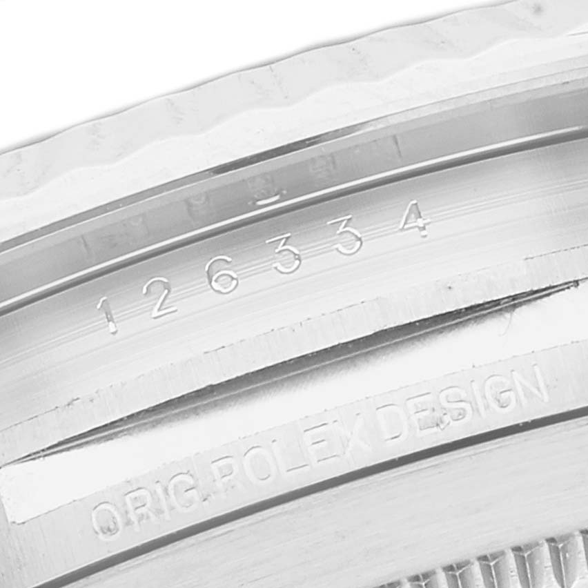 This close-up image shows the engraving on the bezel and inner rim of a Rolex Datejust 41 126334 Men's Stainless Steel Blue Dial 126334 Men's Stainless Steel Blue Dial watch.