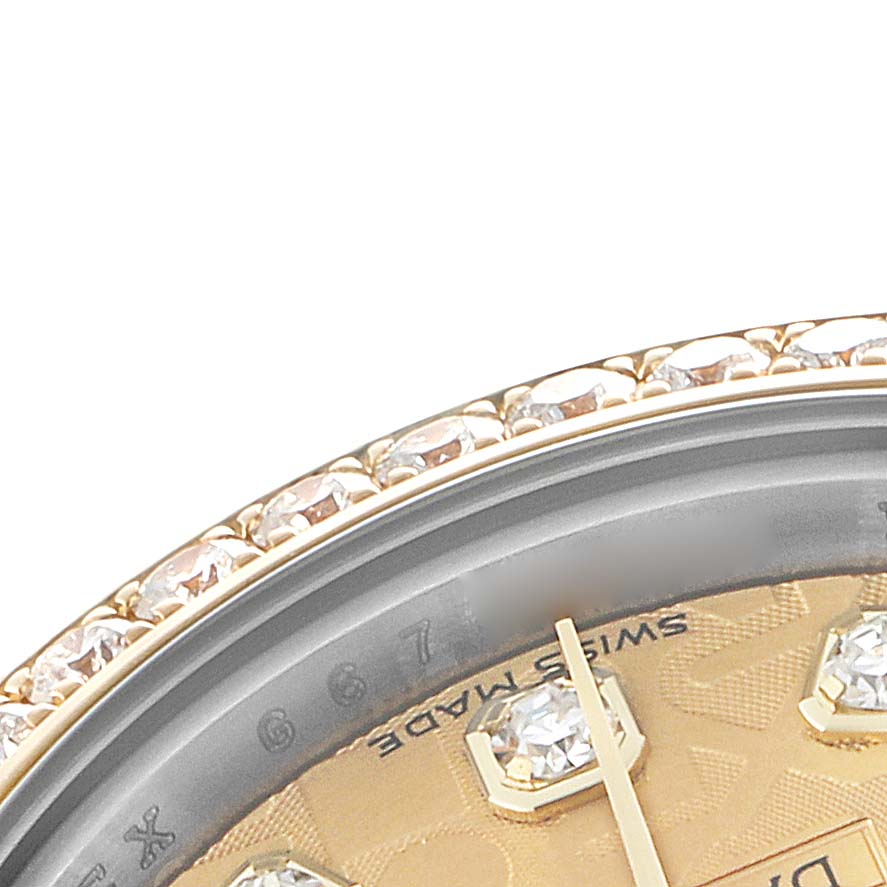 The image shows a close-up of a Rolex Datejust 179383 Women's Steel and Gold (two tone) Champagne Dial watch, featuring a diamond-set bezel, part of the dial, and an hour marker.