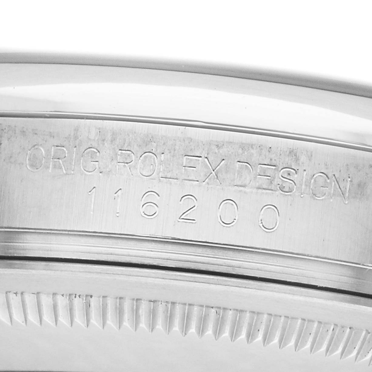 The image shows a close-up of the side of a Rolex Datejust 116200 Men's Stainless Steel Black Dial watch, highlighting the model number and "Orig. Rolex Design" engraving.