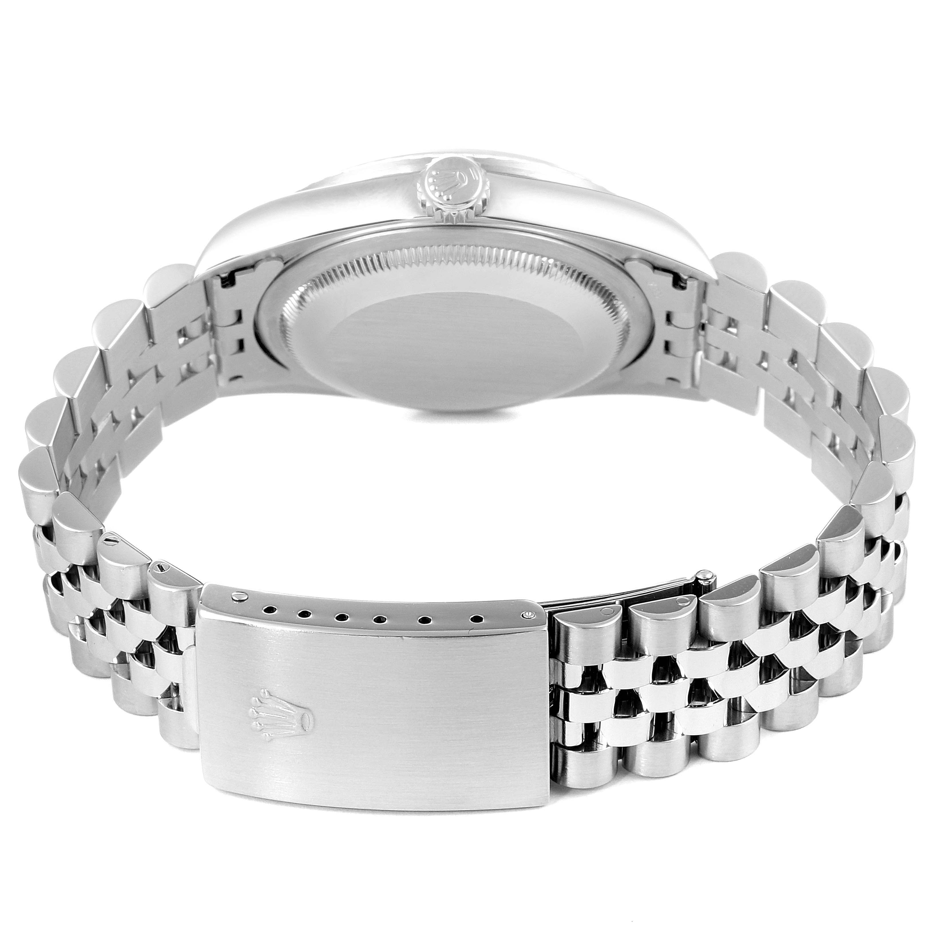 The image shows the back and clasp of a Rolex Datejust 16220 Men
s Stainless Steel Blue Dial 16220 Men
s Stainless Steel Blue Dial watch, highlighting its bracelet and case back.