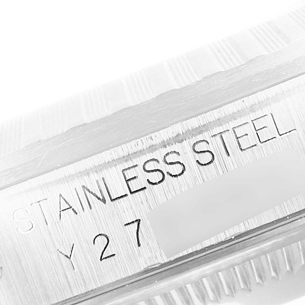 This zoomed-in image of the Rolex Datejust 16220 Men
s Stainless Steel Blue Dial 16220 Men
s Stainless Steel Blue Dial model focuses on the stainless steel part and shows the serial number engraving.