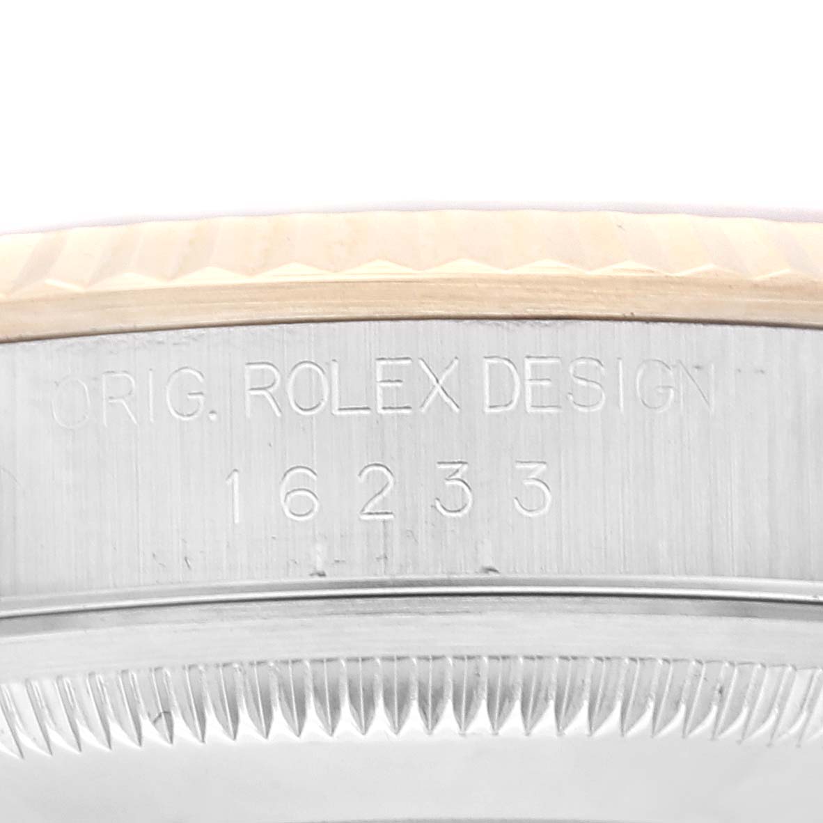 This image shows the case side of a Rolex Datejust 16233 Men's Steel and Gold (two tone) Blue Dial 16233 Men's Steel and Gold (two tone) Blue Dial model 16233, displaying "ORIG. ROLEX DESIGN" engraving.