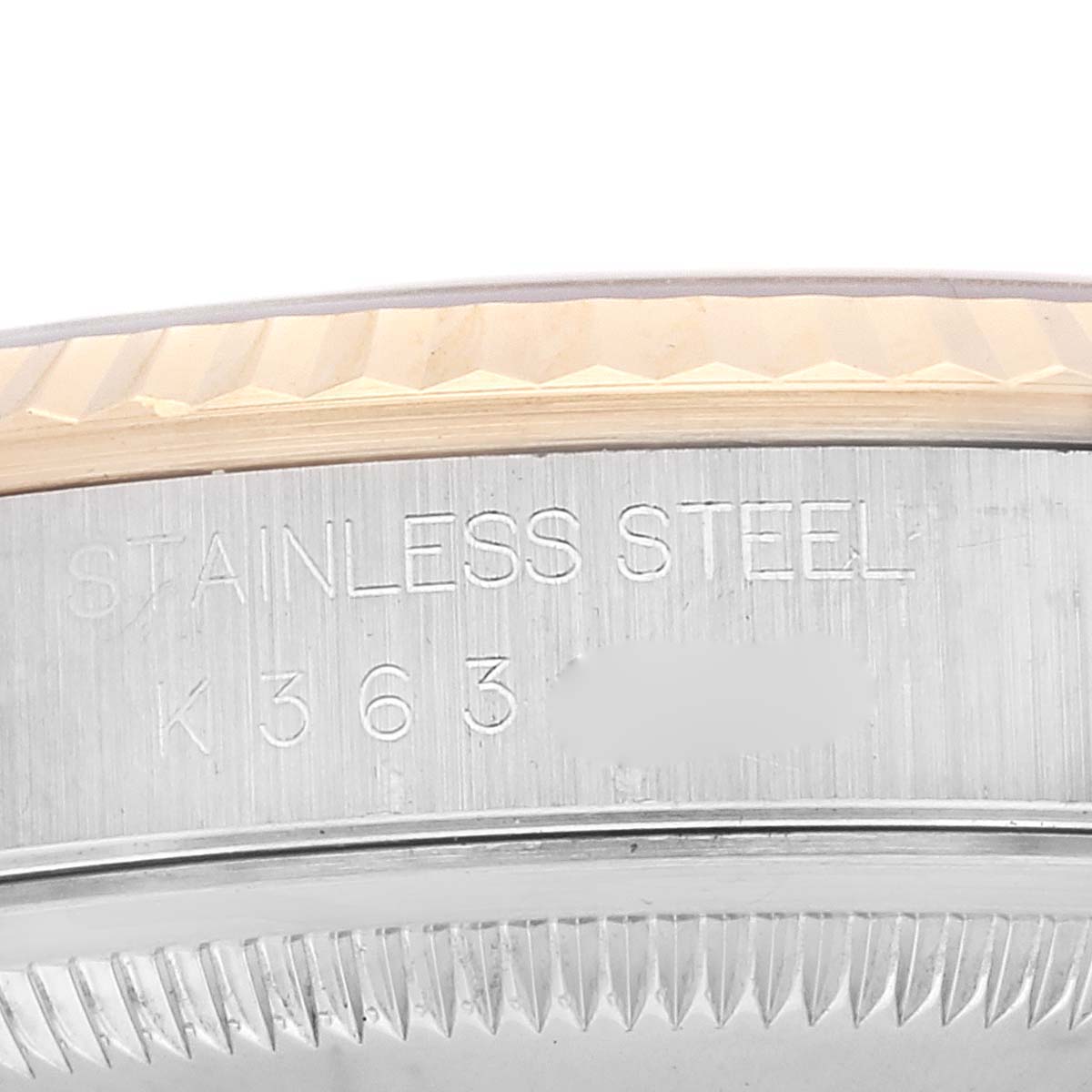 The image shows a close-up of the case edge and fluted bezel of a Rolex Datejust 16233 Men's Steel and Gold (two tone) Blue Dial 16233 Men's Steel and Gold (two tone) Blue Dial watch, highlighting the model inscription.
