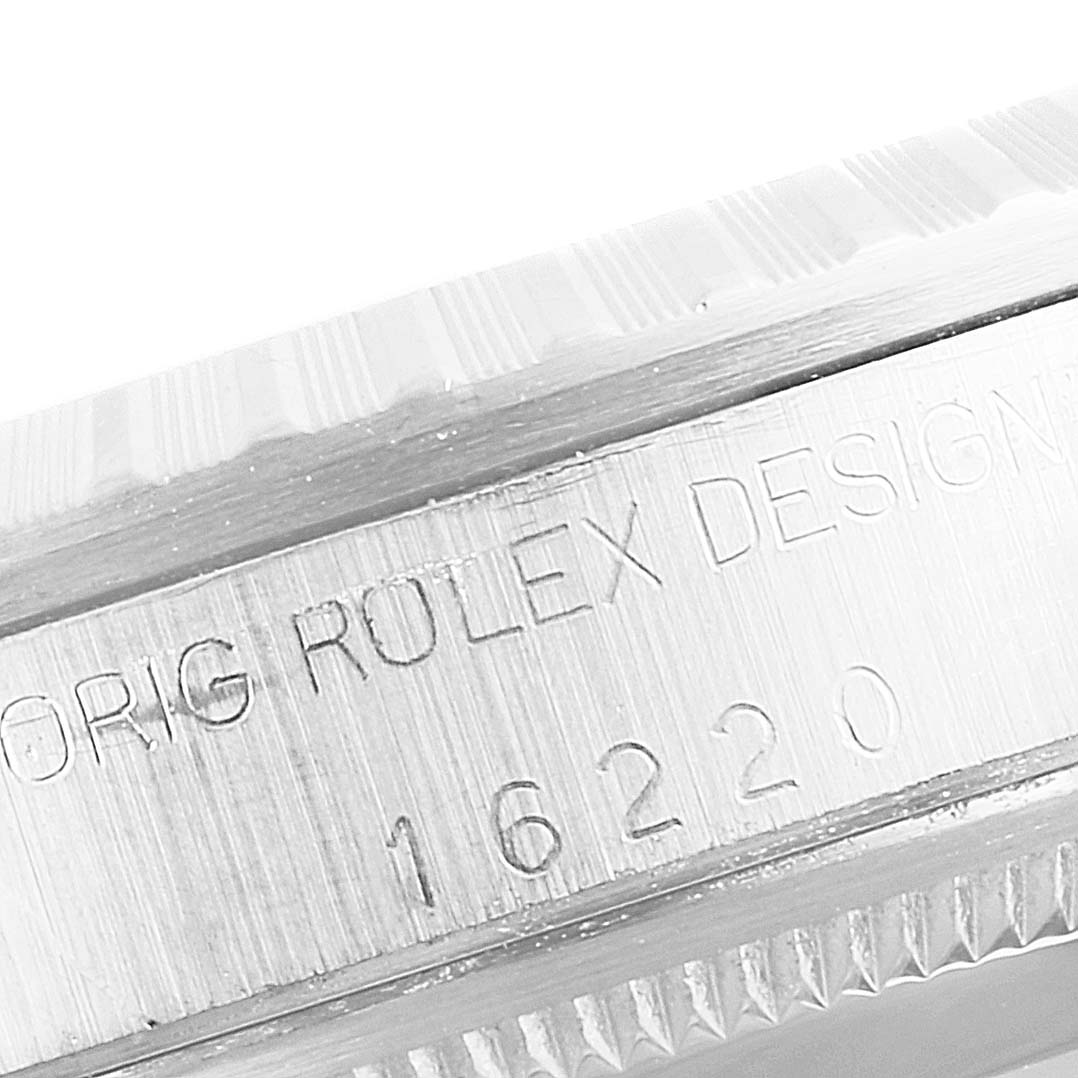 This is a close-up image of the case side of a Rolex Datejust 16220 Men
s Stainless Steel Grey Dial 16220 Men
s Stainless Steel Grey Dial watch, showing its engraved model number 16220.