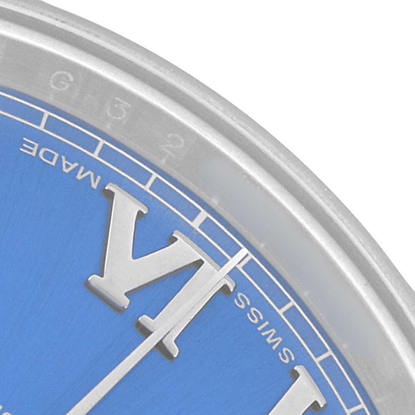 The image shows a close-up of the Rolex Datejust 41 116334 Men's Stainless Steel Blue Dial watch face, highlighting the Roman numeral 'VI,' part of the blue dial, and bezel.
