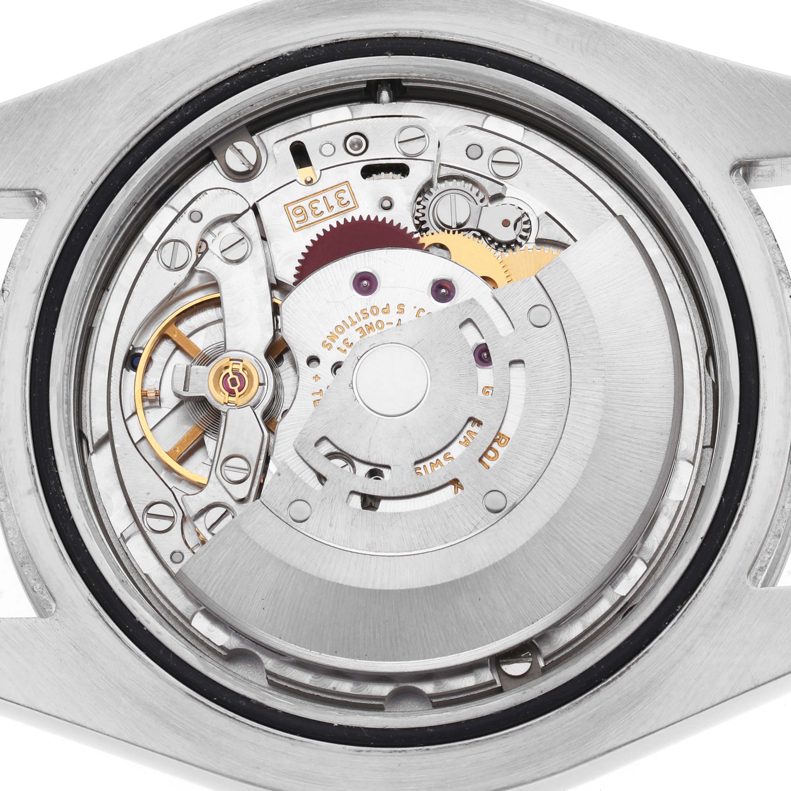 The image shows the movement of a Rolex Datejust 41 116334 Men's Stainless Steel Silver Dial, viewed from the back, displaying gears and intricate mechanisms.