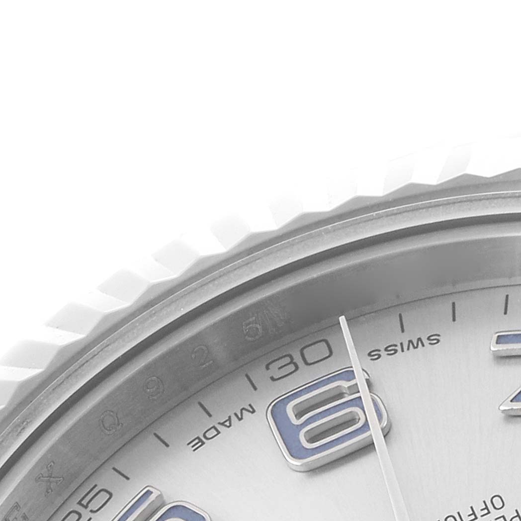 The image shows a close-up of the dial, bezel, and part of the minute hand of a Rolex Datejust 41 116334 Men's Stainless Steel Silver Dial watch.