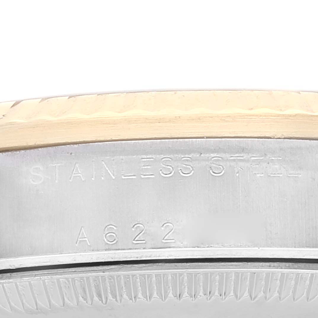 This image shows a close-up of the serial number and "Stainless Steel" engraving on the side of a Rolex Mid-Size 78273 Women
s Steel and Gold (two tone) White Dial 78273 Women
s Steel and Gold (two tone) White Dial model watch.