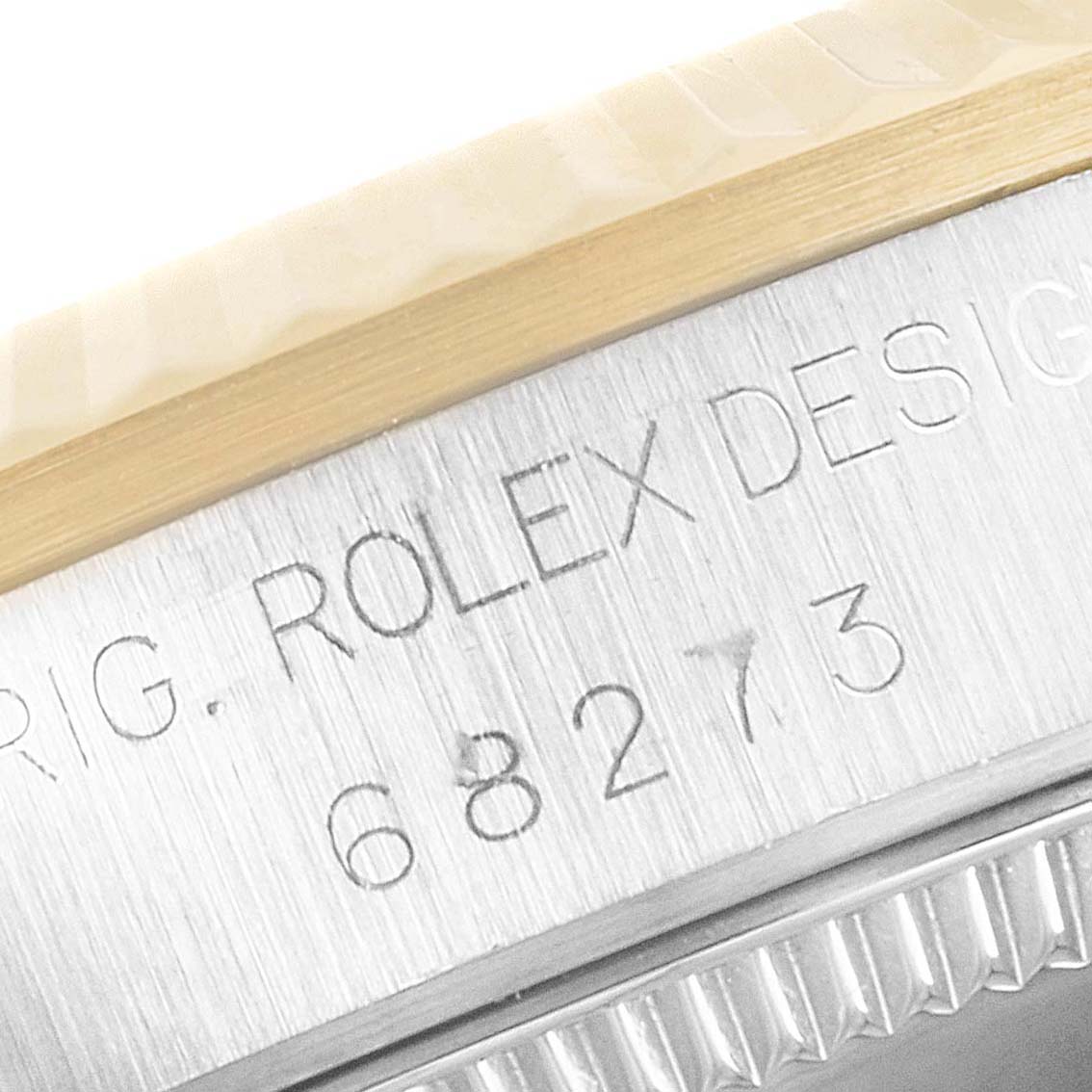 The image shows a close-up of the serial number engraved on the case side of a Mid-Size Rolex watch.
