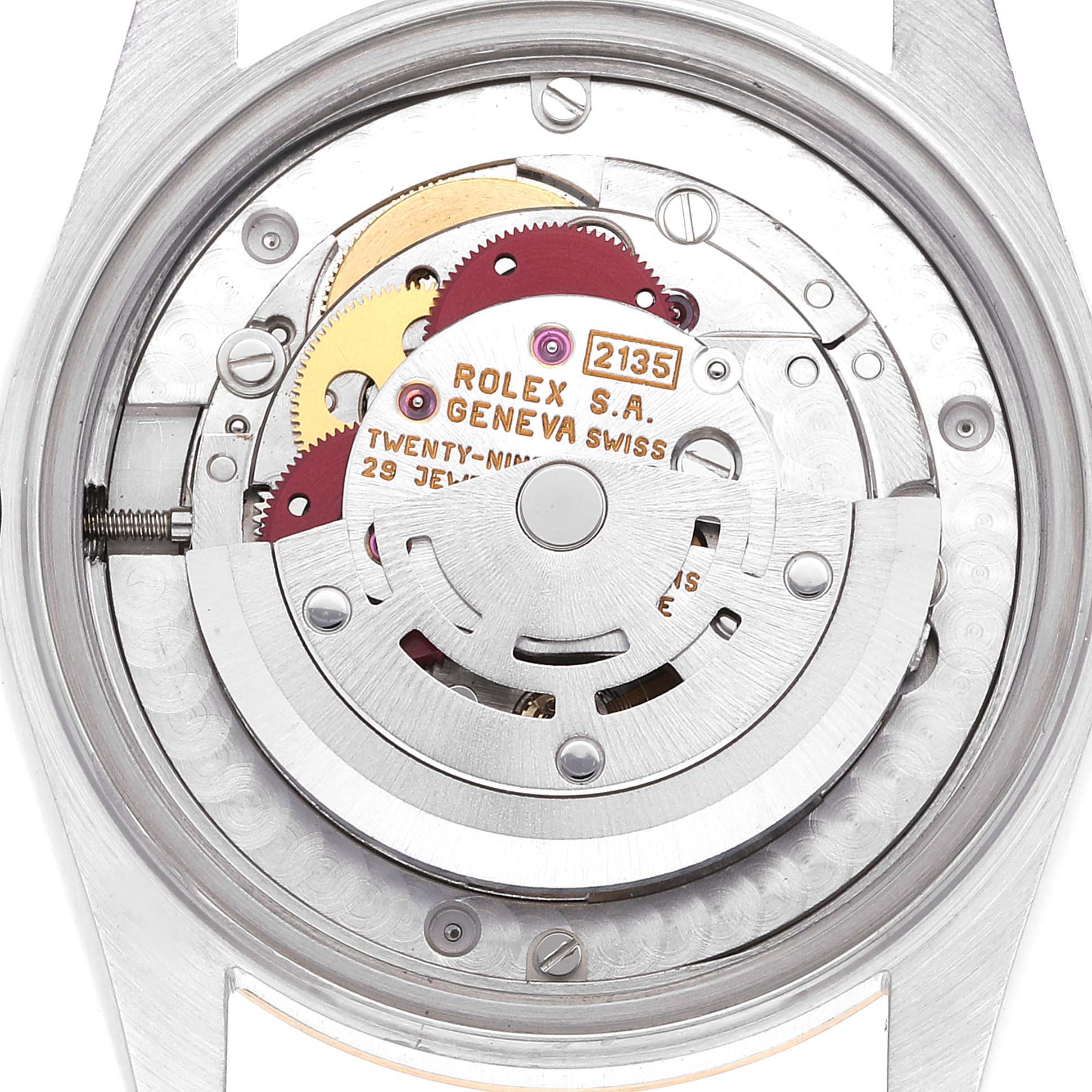 The image shows the intricate back view of the Rolex Mid-Size 68273 Women
s Steel and Gold (two tone) Black Dial 68273 Women
s Steel and Gold (two tone) Black Dial model
s movement, displaying its components and engravings.