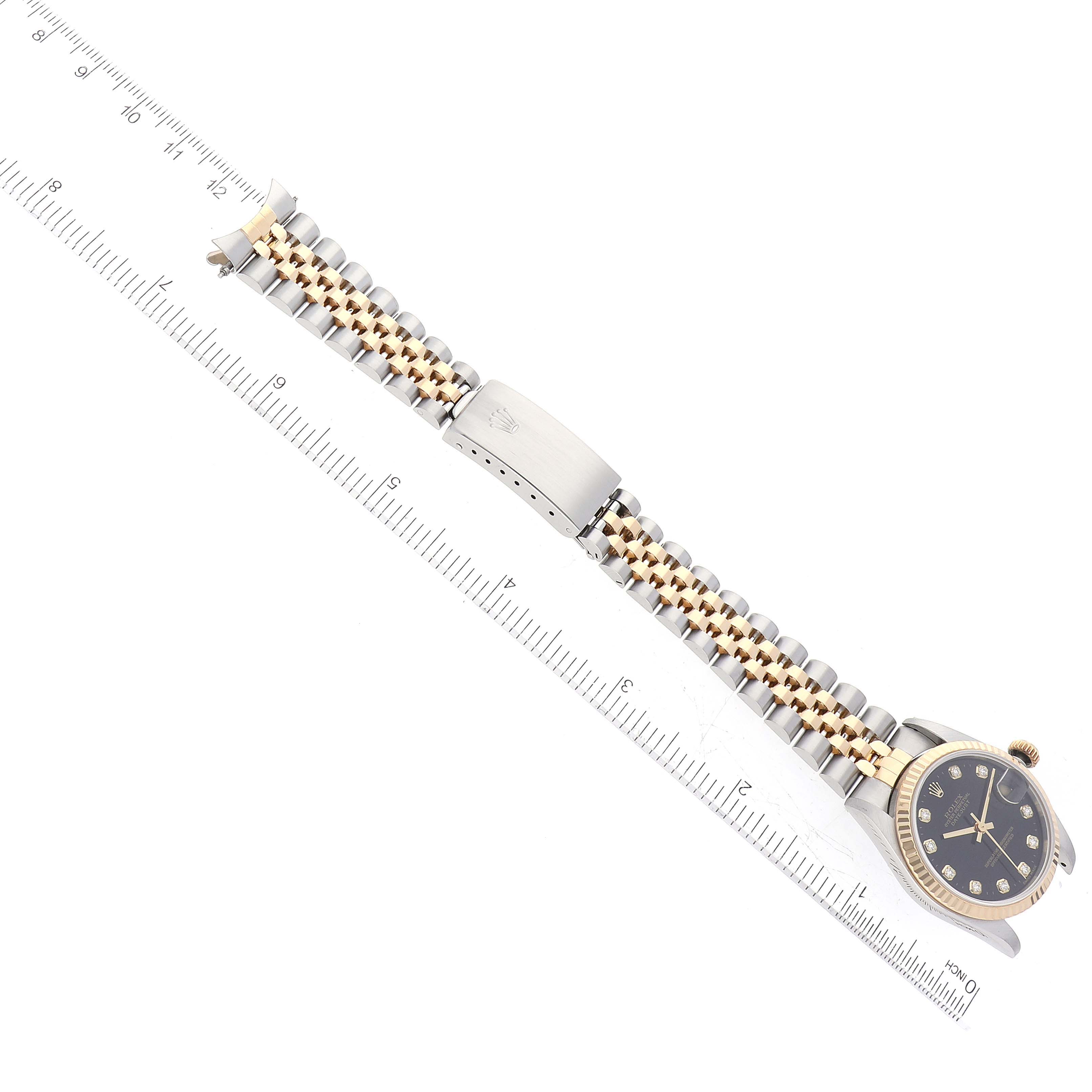 The image shows a Mid-Size Rolex watch, positioned flat with a visible face, bracelet, and clasp.