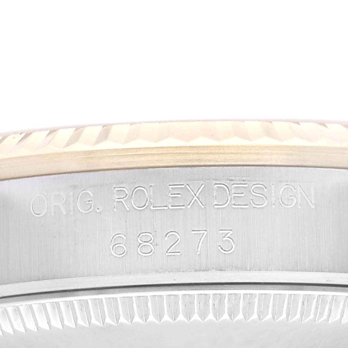 The image shows a close-up of the case side and bezel edge of a mid-size Rolex watch, displaying the "ORIG. ROLEX DESIGN" engraving and model number 68273.