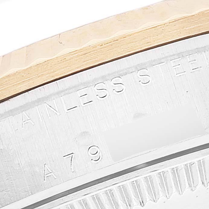 The image shows a close-up of the stainless steel case back and bezel of a Rolex Mid-Size 78273 Women
s Steel and Gold (two tone) Champagne Dial 78273 Women
s Steel and Gold (two tone) Champagne Dial model watch.