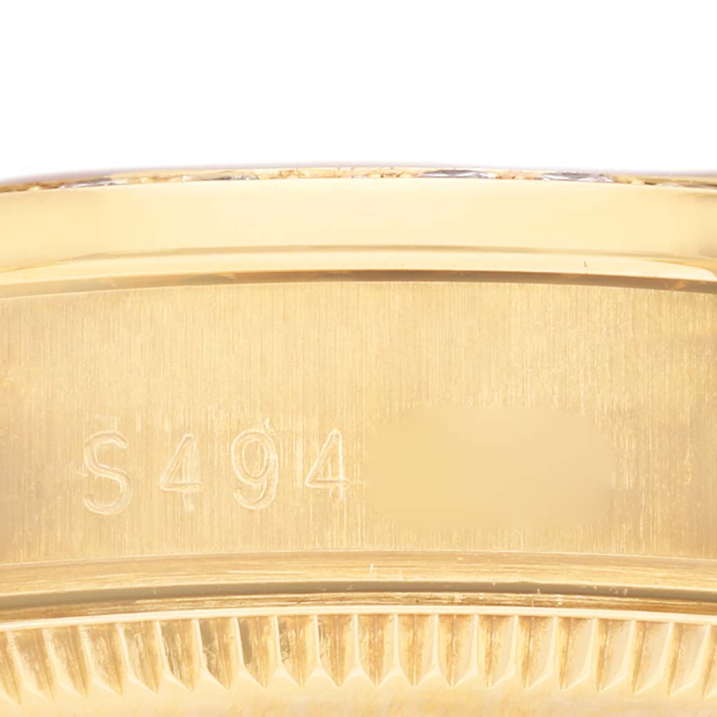 The image shows a close-up side view of the Rolex President 68158 Women's Yellow Gold Champagne Dial 68158 Women's Yellow Gold Champagne Dial model focusing on its engraved serial number.