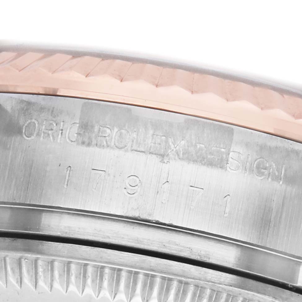 The image shows a close-up angle of the Rolex Datejust 179171 Women's Steel and Gold (two tone) Silver Dial model, highlighting the edge of the bezel and the engraved side of the case.