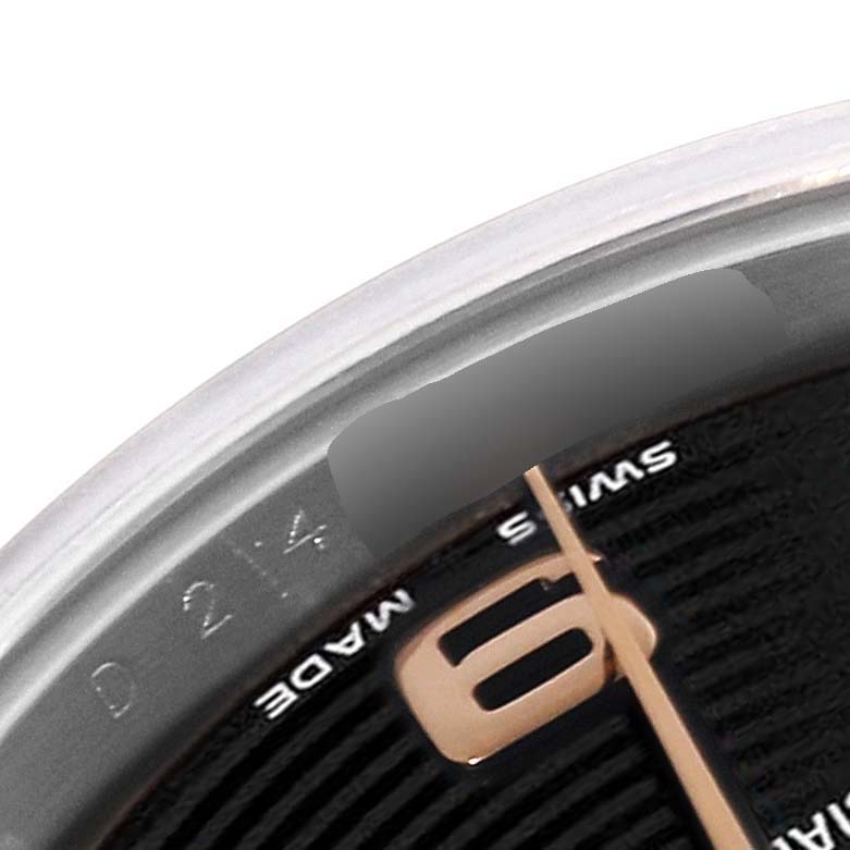 This image shows a close-up of the dial and bezel of a Rolex Datejust 179161 Women's Steel and Gold (two tone) Black Dial 179161 Women's Steel and Gold (two tone) Black Dial watch, focusing on the "6" numeral and a partial serial number.