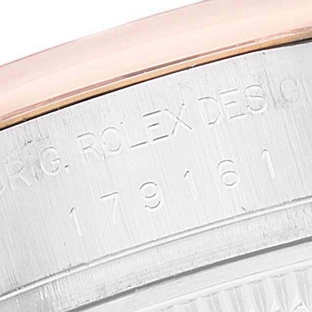 This image shows a close-up of the side casing of a Rolex Datejust 179161 Women's Steel and Gold (two tone) Black Dial 179161 Women's Steel and Gold (two tone) Black Dial watch, focusing on its engraved serial number.