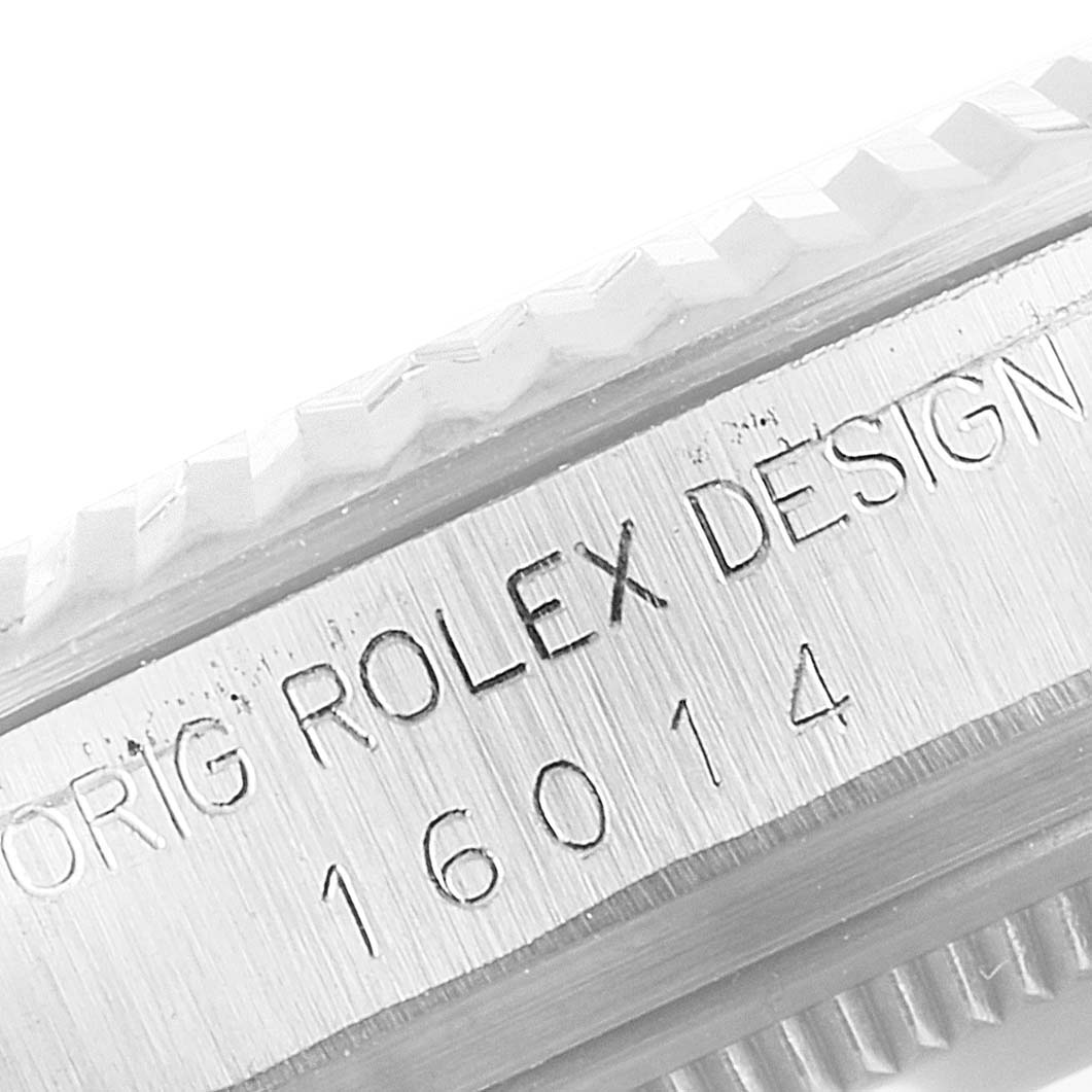 This image shows a close-up of the case with an engraved serial number for a Rolex Datejust 16014 Men
s Stainless Steel Silver Dial 16014 Men
s Stainless Steel Silver Dial model.