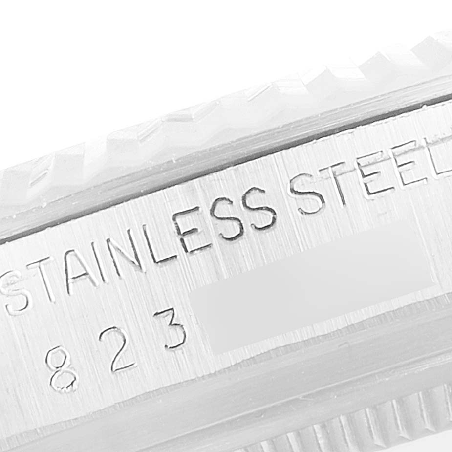 This is a close-up of the serial engraving on the stainless-steel side of a Rolex Datejust 16014 Men
s Stainless Steel Silver Dial 16014 Men
s Stainless Steel Silver Dial watch.
