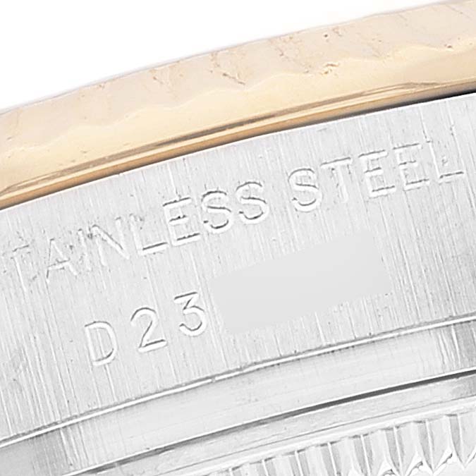 The image shows a close-up of the side of a Rolex Datejust 179173 Women's Steel and Gold (two tone) Beige Dial 179173 Women's Steel and Gold (two tone) Beige Dial watch, highlighting its stainless steel and gold bezel.