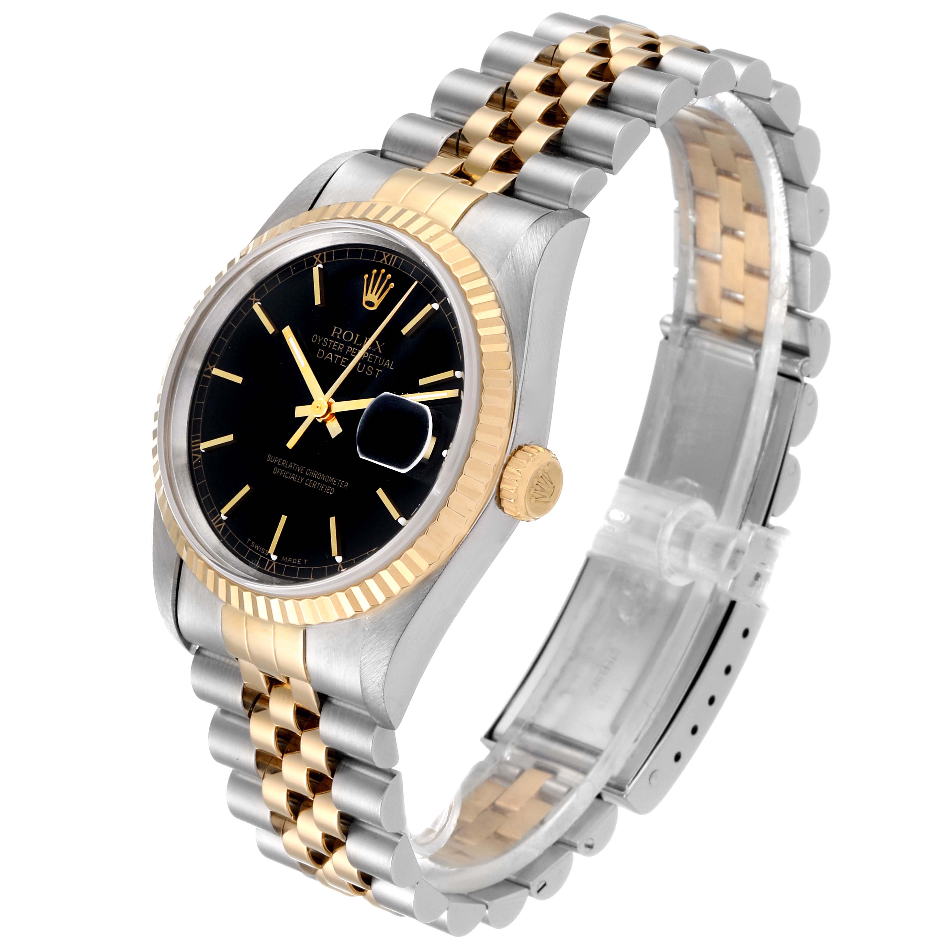 This image shows a Rolex Datejust 16233 Men
s Steel and Gold (two tone) Black Dial 16233 Men
s Steel and Gold (two tone) Black Dial watch at an angled view, highlighting its black dial, fluted bezel, and two-tone metallic bracelet.