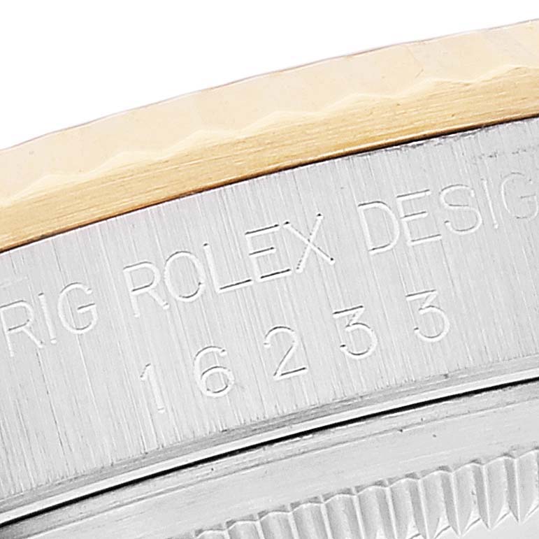 This close-up angle shows the model number and part of the bezel of a Rolex Datejust 16233 Men's Steel and Gold (two tone) Black Dial 16233 Men's Steel and Gold (two tone) Black Dial watch.