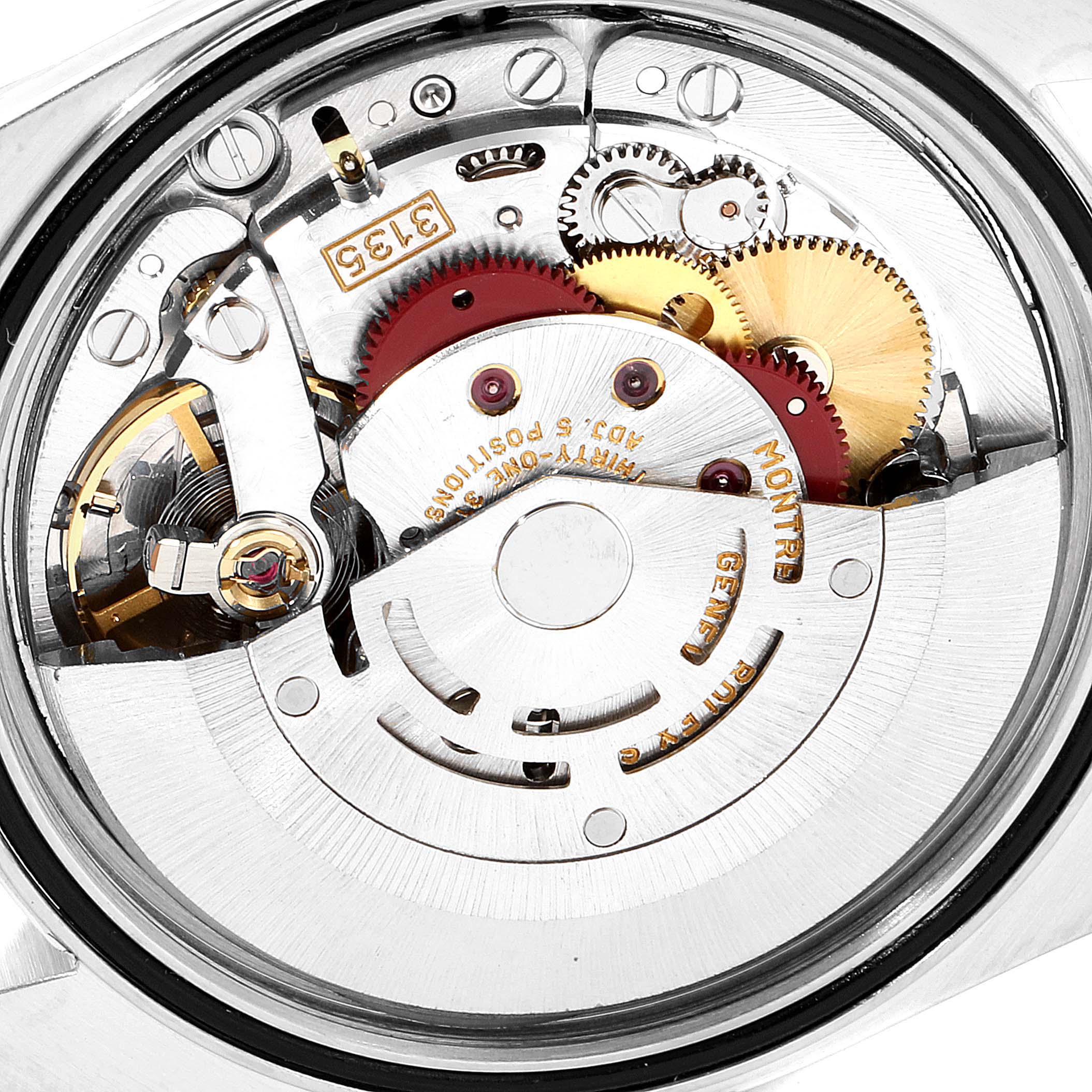 This image shows the intricate inner movement mechanism of a Rolex Datejust 16233 Men
s Steel and Gold (two tone) Black Dial 16233 Men
s Steel and Gold (two tone) Black Dial watch from a top-down view.