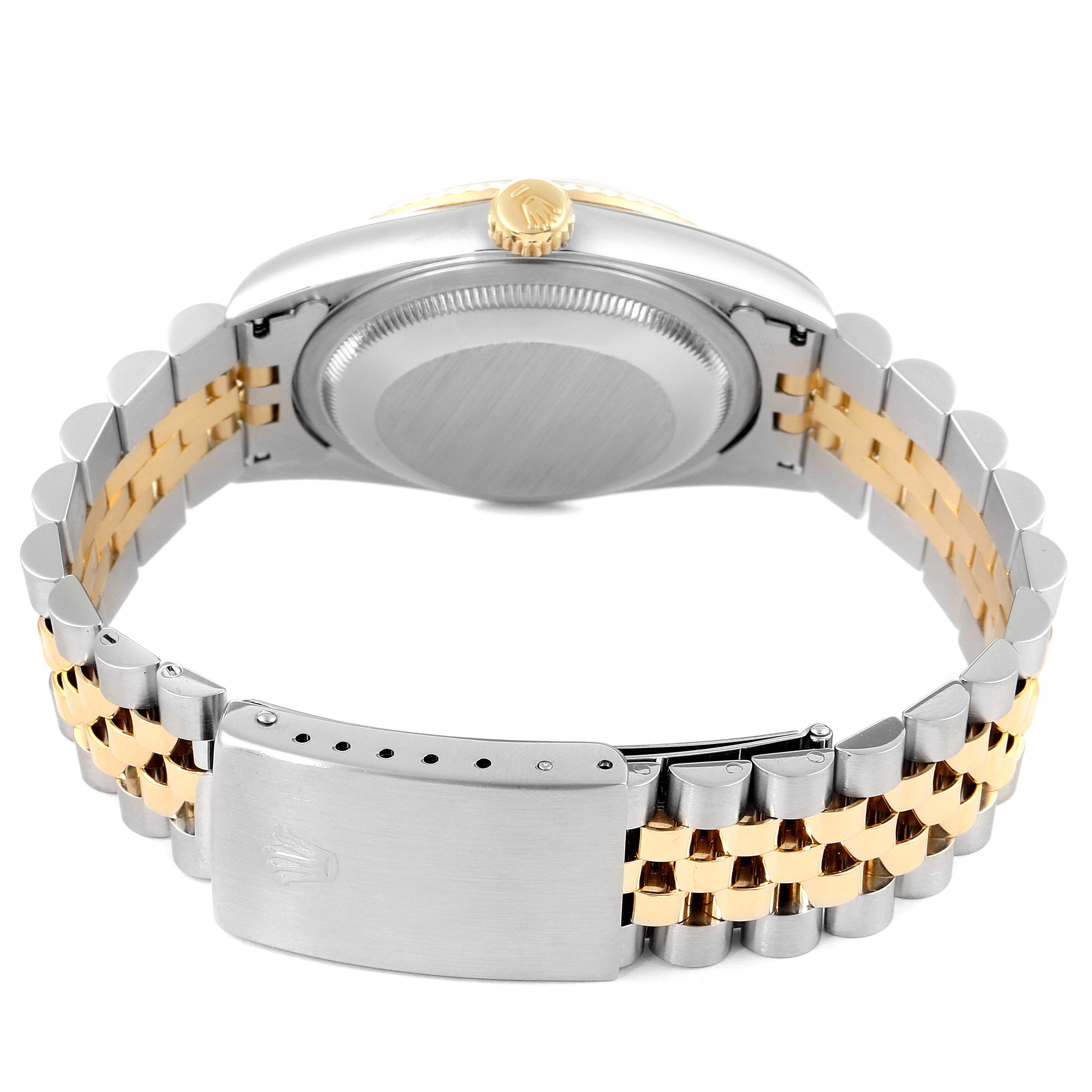 This image shows the back view of a Rolex Datejust 16233 Men
s Steel and Gold (two tone) Black Dial 16233 Men
s Steel and Gold (two tone) Black Dial watch, highlighting the bracelet and the case back.