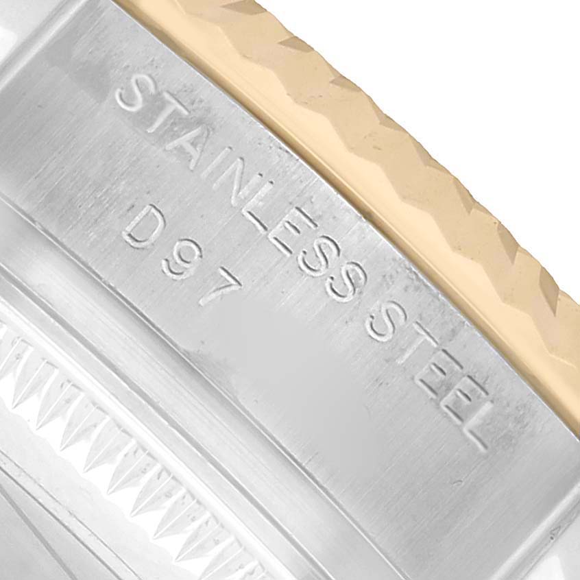 The image shows a close-up of the engraved text on the stainless steel case side of a Rolex Datejust 179173 Women's Steel and Gold (two tone) Champagne Dial watch.