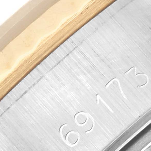 The image shows a close-up of the bracelet and case part of a Rolex Datejust 69173 Women's Steel and Gold (two tone) Champagne Dial 69173 Women's Steel and Gold (two tone) Champagne Dial watch, with visible serial numbers.