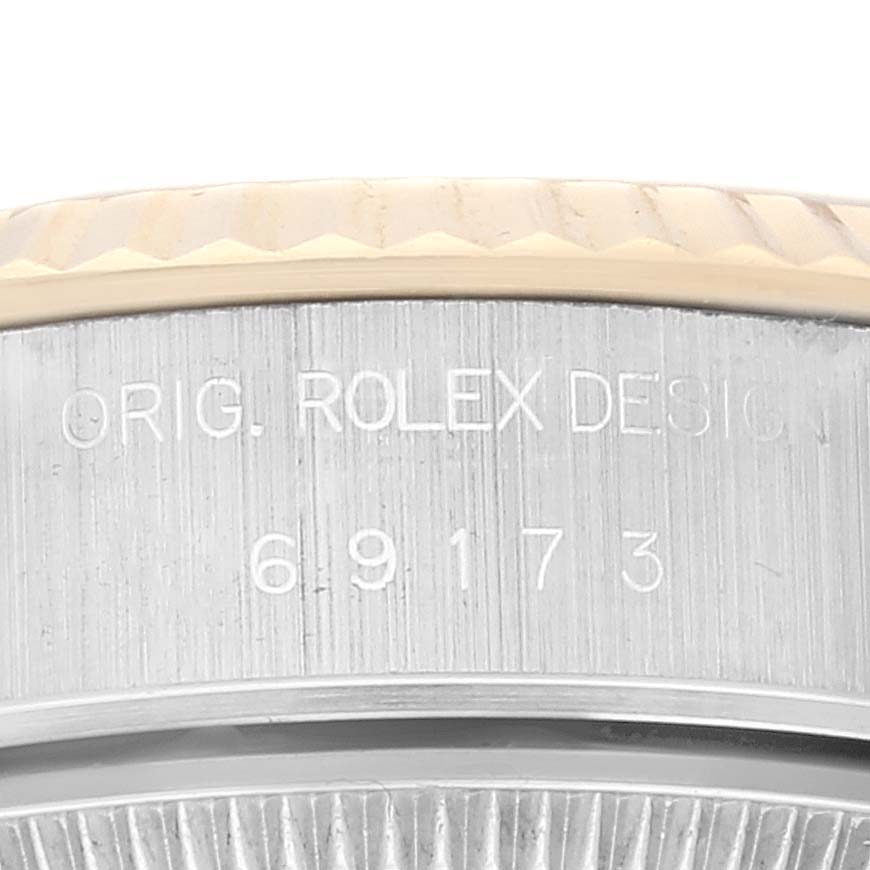 The image shows a close-up of the model number "69173" and "ORIG. ROLEX DESIGN" inscribed on the case of a Rolex Datejust 69173 Women's Steel and Gold (two tone) Champagne Dial 69173 Women's Steel and Gold (two tone) Champagne Dial watch.