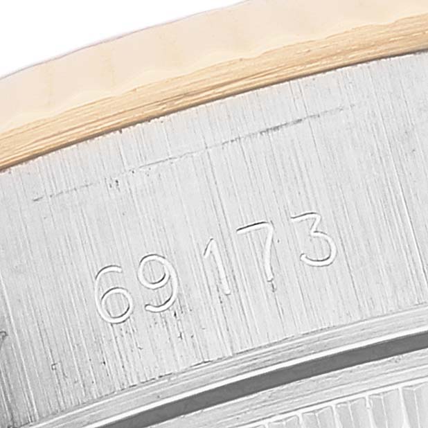 The image shows a close-up of the side of the case of a Rolex Datejust 69173 Women's Steel and Gold (two tone) Champagne Dial 69173 Women's Steel and Gold (two tone) Champagne Dial watch with model number 69173 engraved.